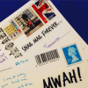 Snail mail stickers on postcards